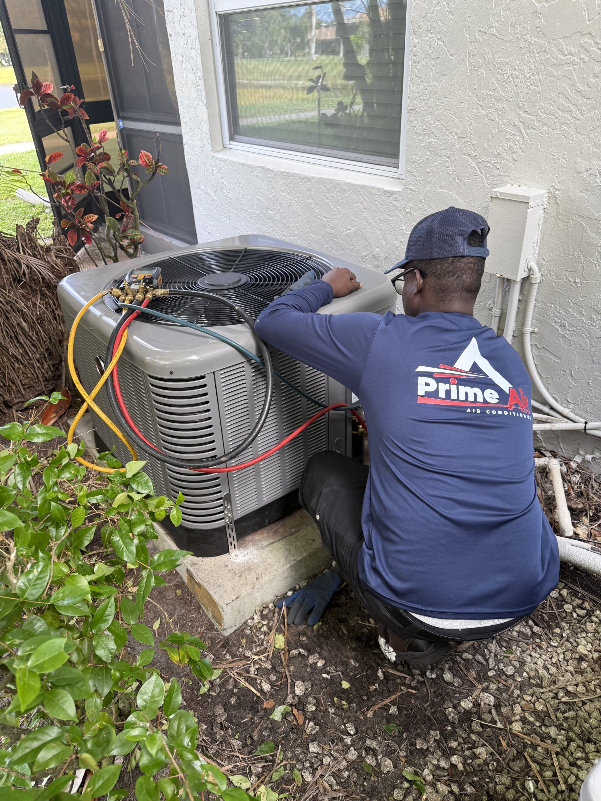 Prime Air HVAC technicians on the job — licensed AC repair and installation team Boca Raton FL