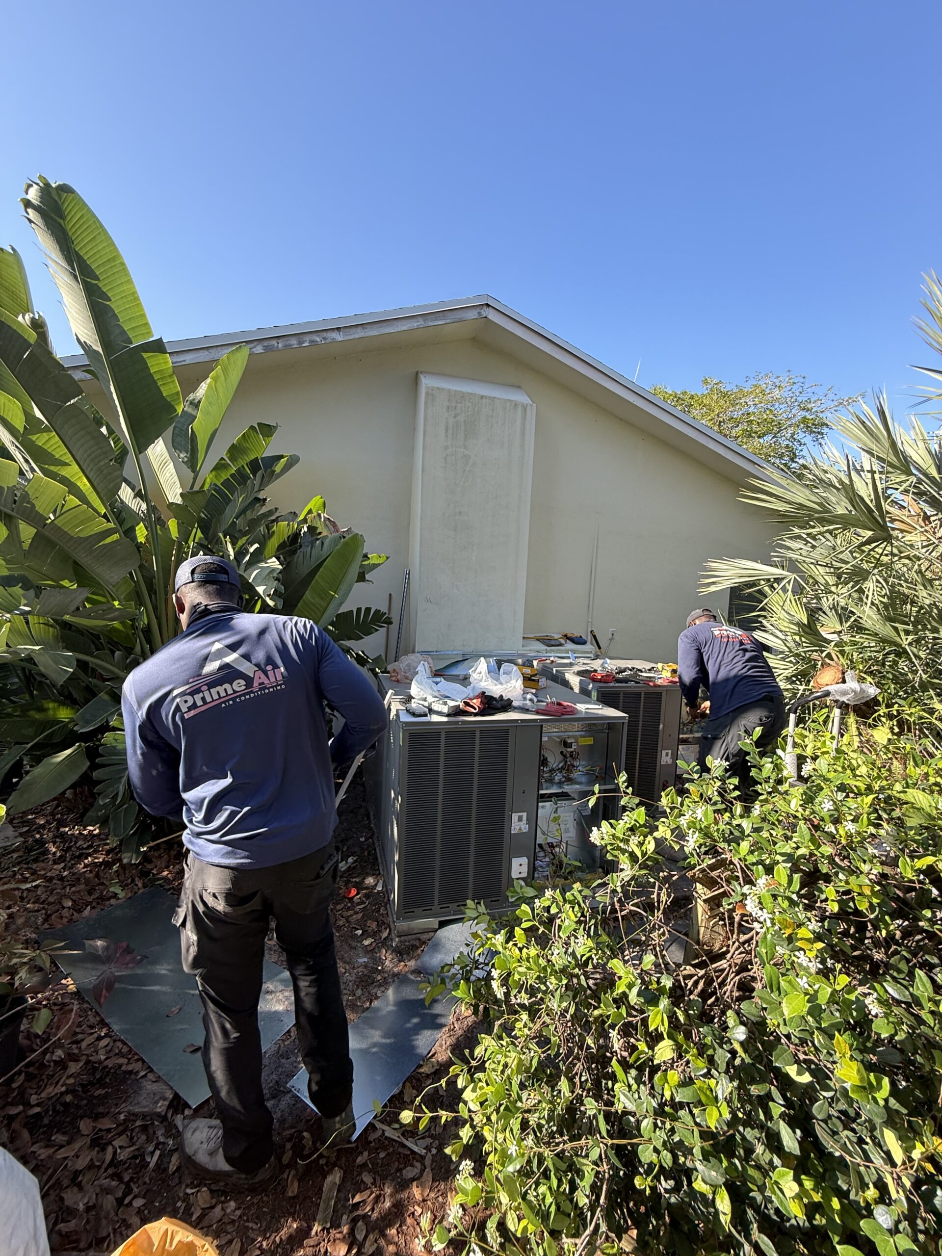 Prime Air HVAC technicians on the job — licensed AC repair and installation team Boca Raton FL