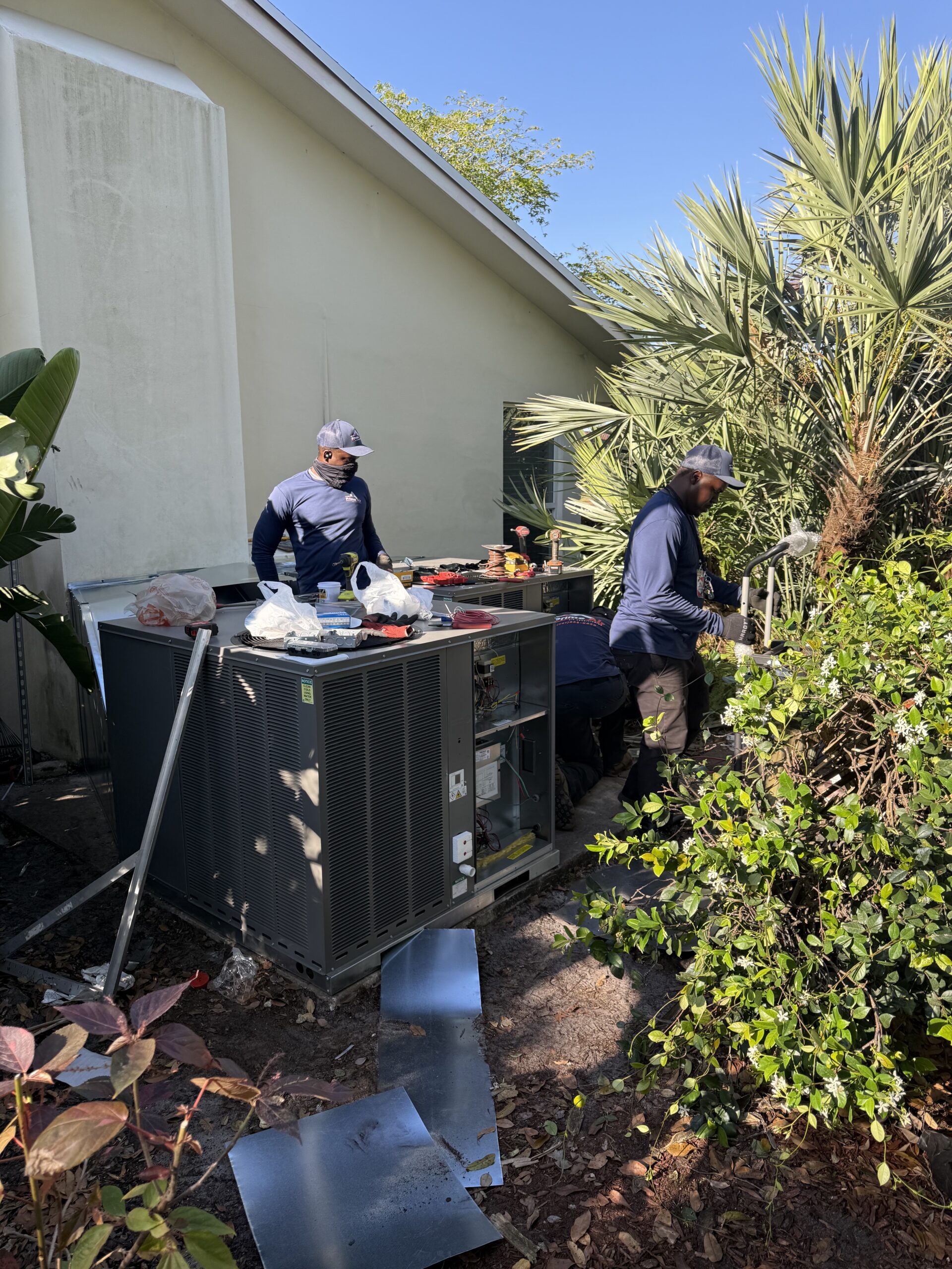 Prime Air HVAC technicians on the job — licensed AC repair and installation team Boca Raton FL