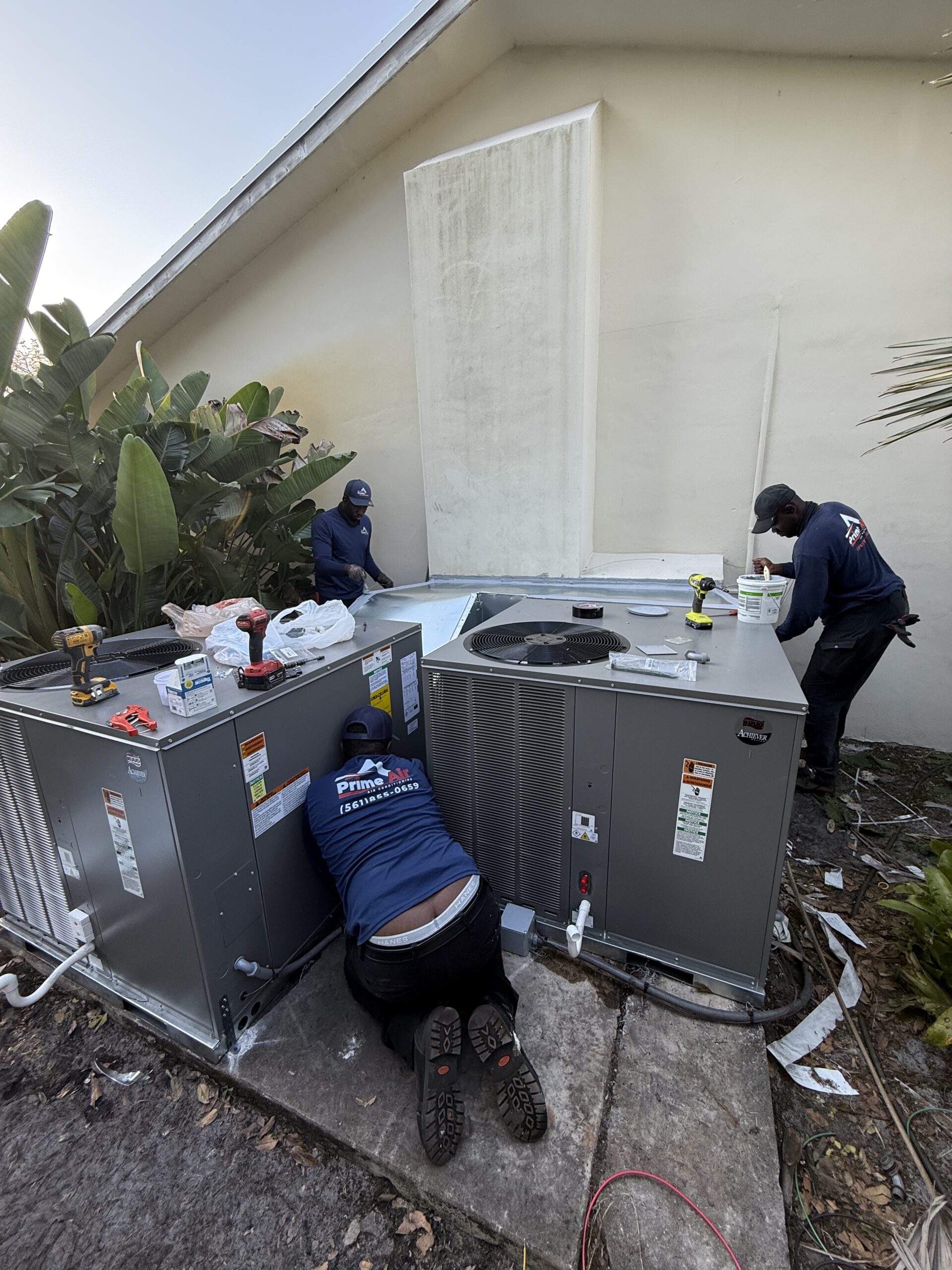 Prime Air HVAC technicians on the job — licensed AC repair and installation team Boca Raton FL