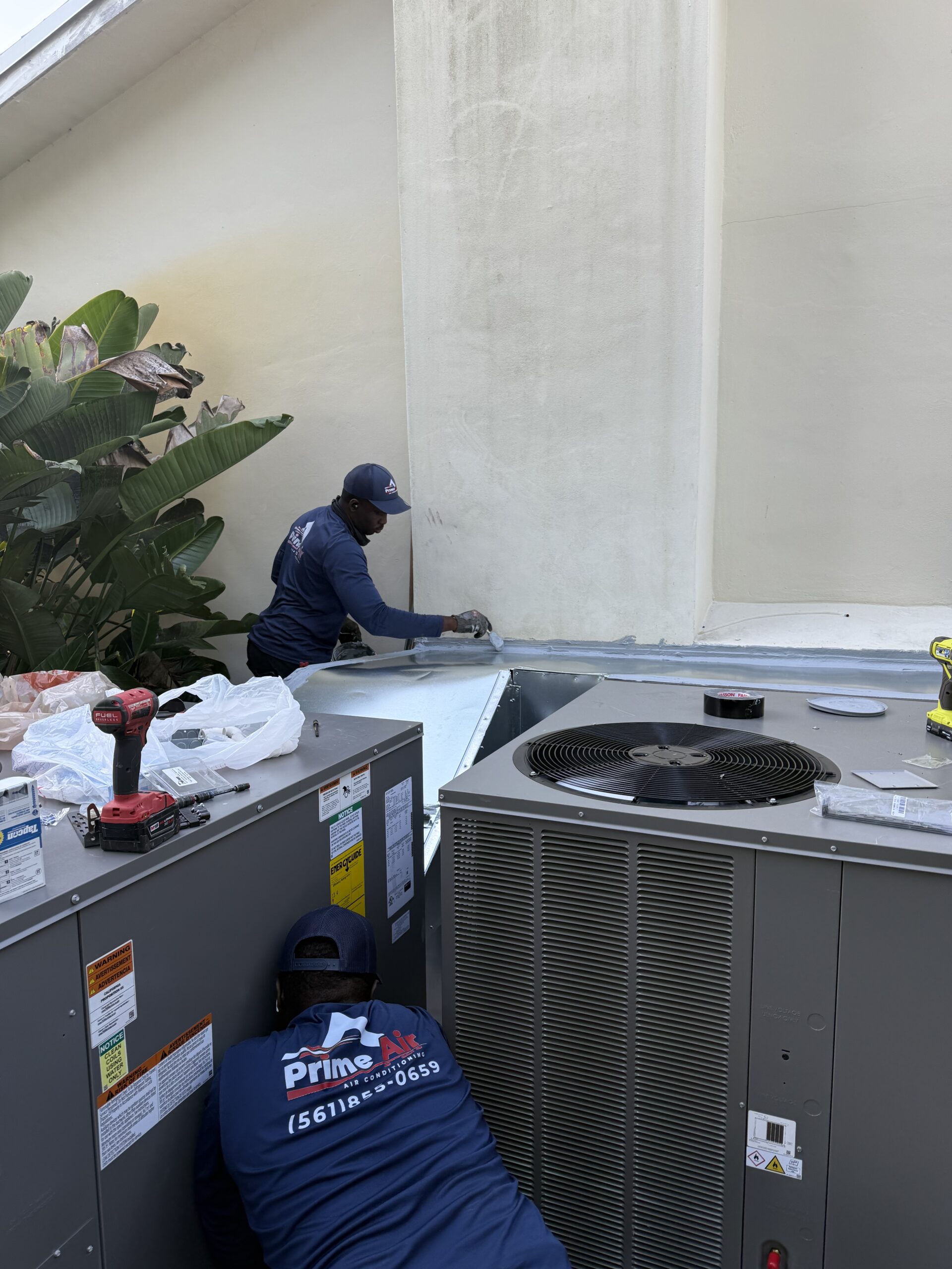 Prime Air HVAC technicians on the job — licensed AC repair and installation team Boca Raton FL