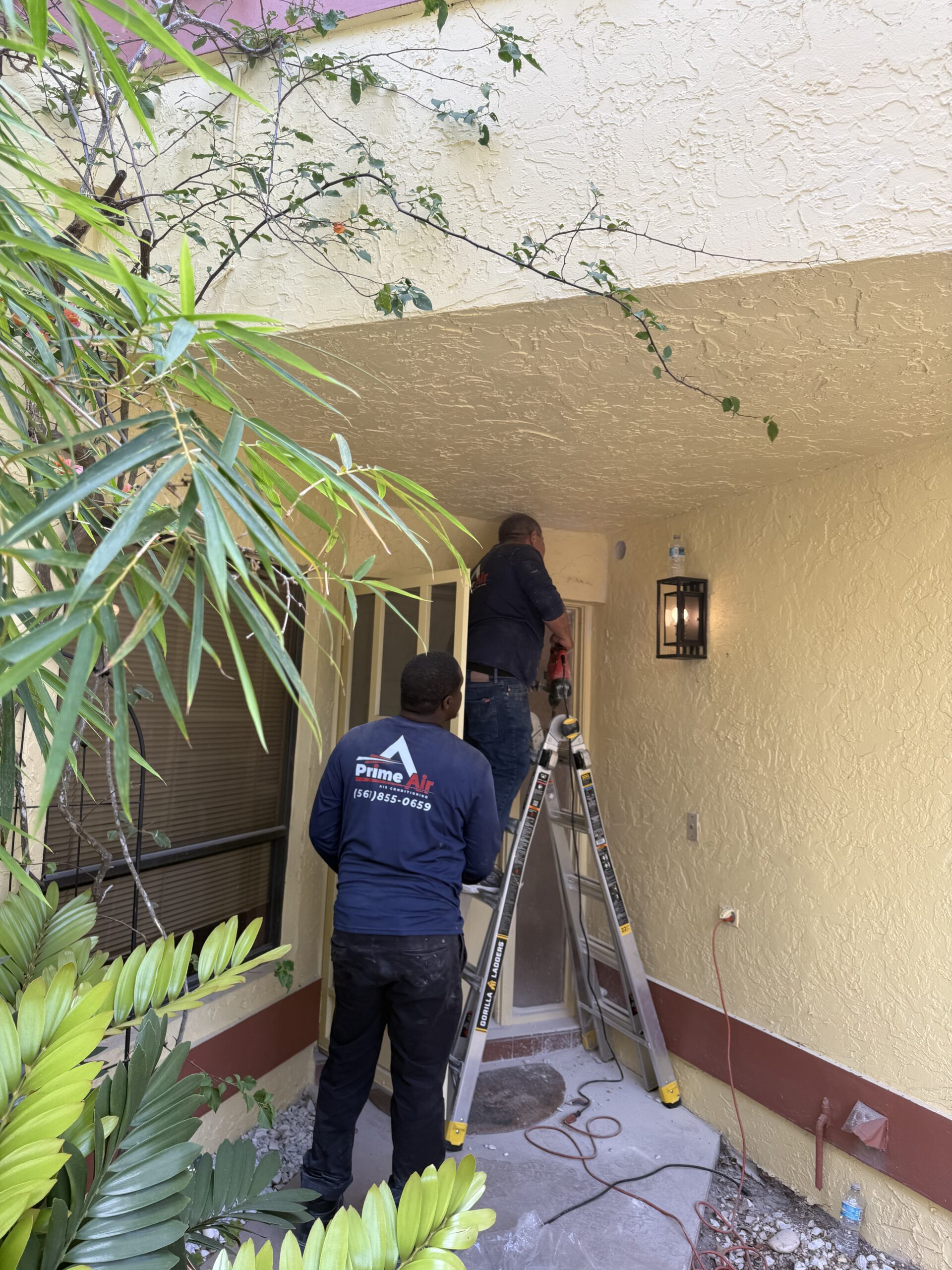 Prime Air HVAC technicians on the job — licensed AC repair and installation team Boca Raton FL