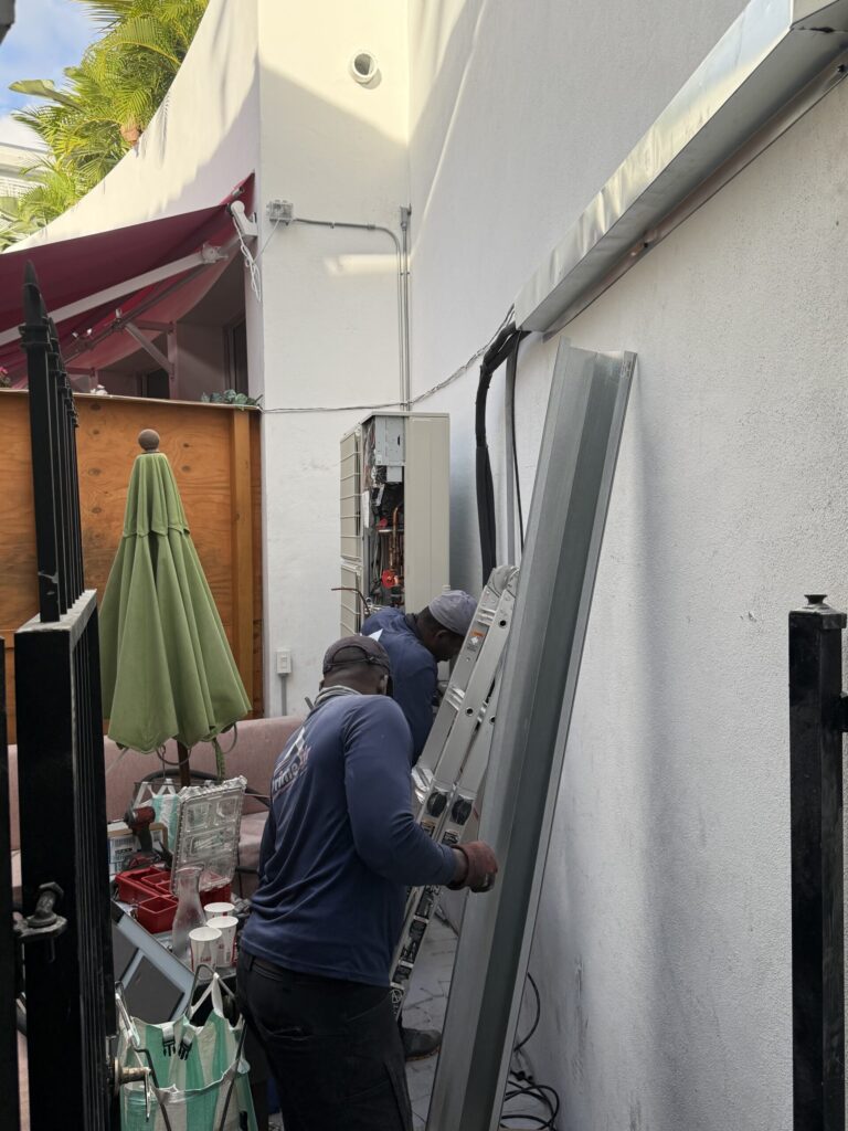Prime Air licensed HVAC technicians installing outdoor AC unit — AC installation Boca Raton FL