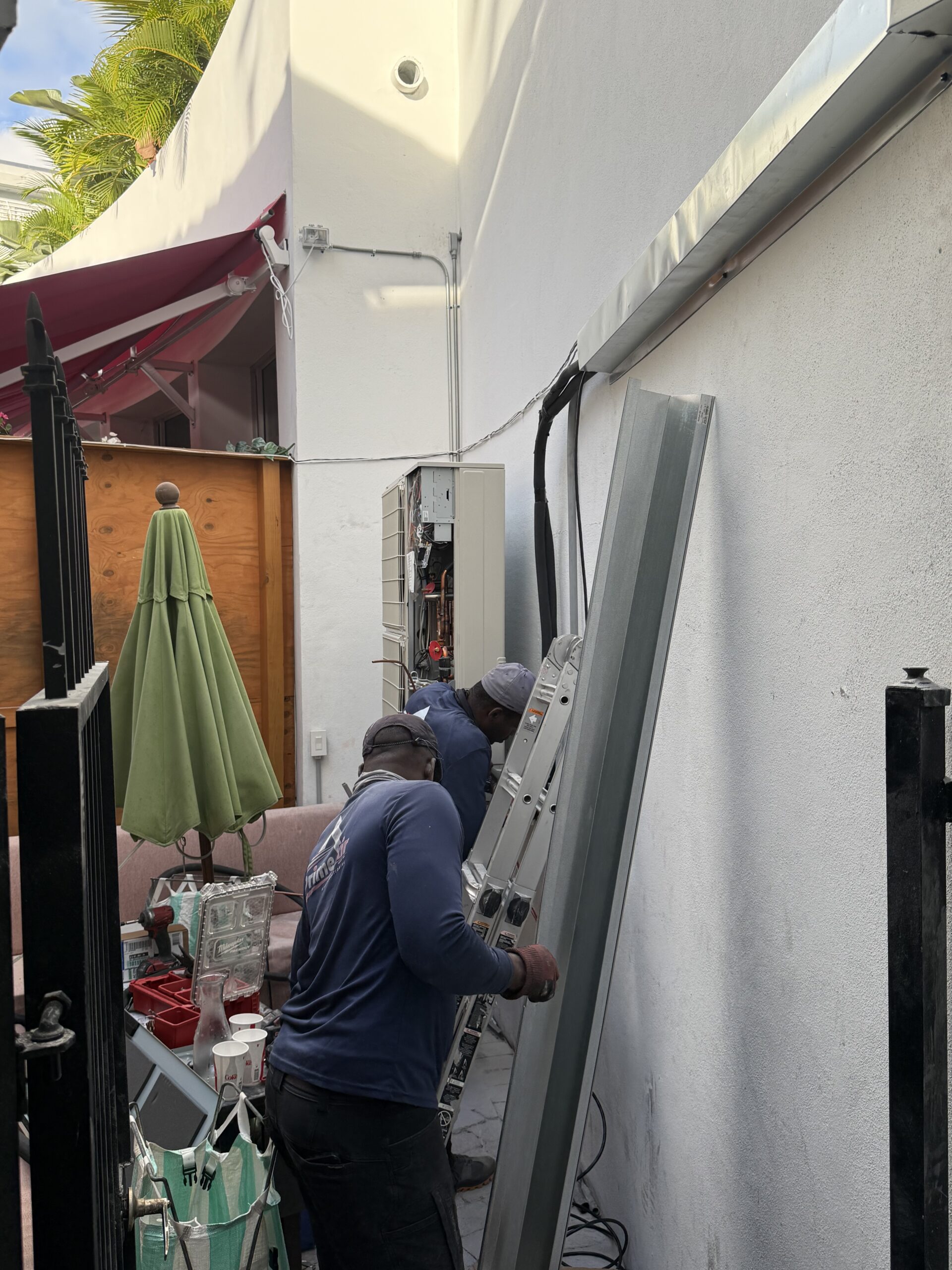 Prime Air technicians installing outdoor AC unit Boca Raton emergency repair